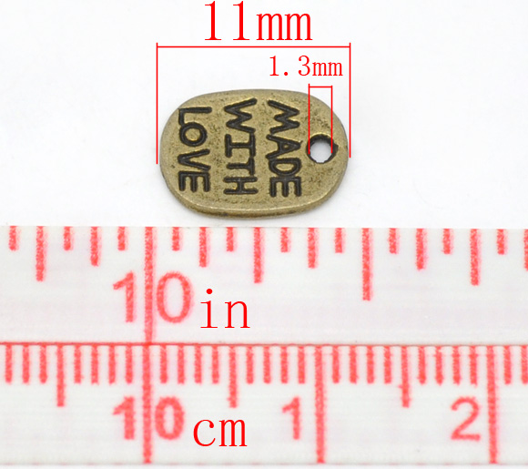 ตัวห้อย antique bronze สลักคำว่า Made With Love ขนาด 11x8mm แพ็ค 50 ชิ้น