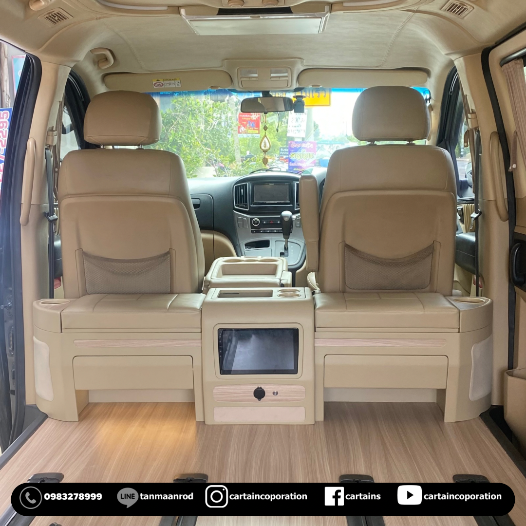 เอาคอนโซลเก่าออกถอดเครื่องเสียงจอลำโพง ออกมาปั้นคอนโซลเตี้ยตัวใหม่ให้คนขับปรับเอนได้สบาย มีที่วางแก้ววางเท้าให้คนนั่งด้านหลัง