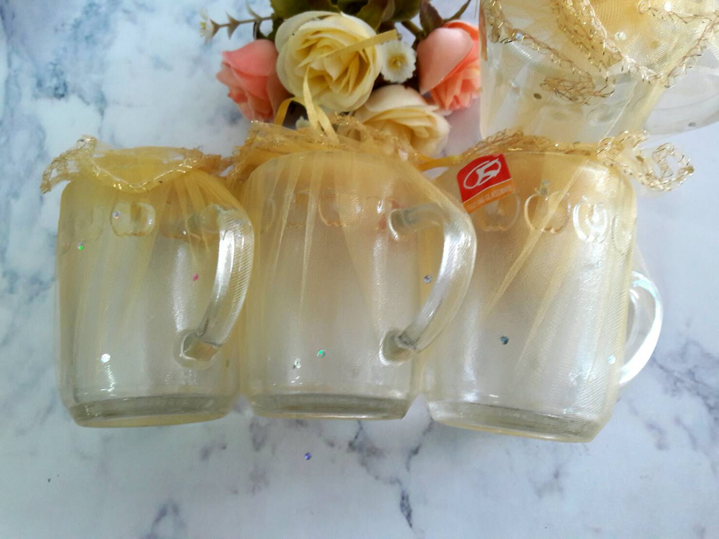 แก้วหูใส (ลายแอ็ปเปิ้ล) ถุงผ้าไหมทองใบใหญ่