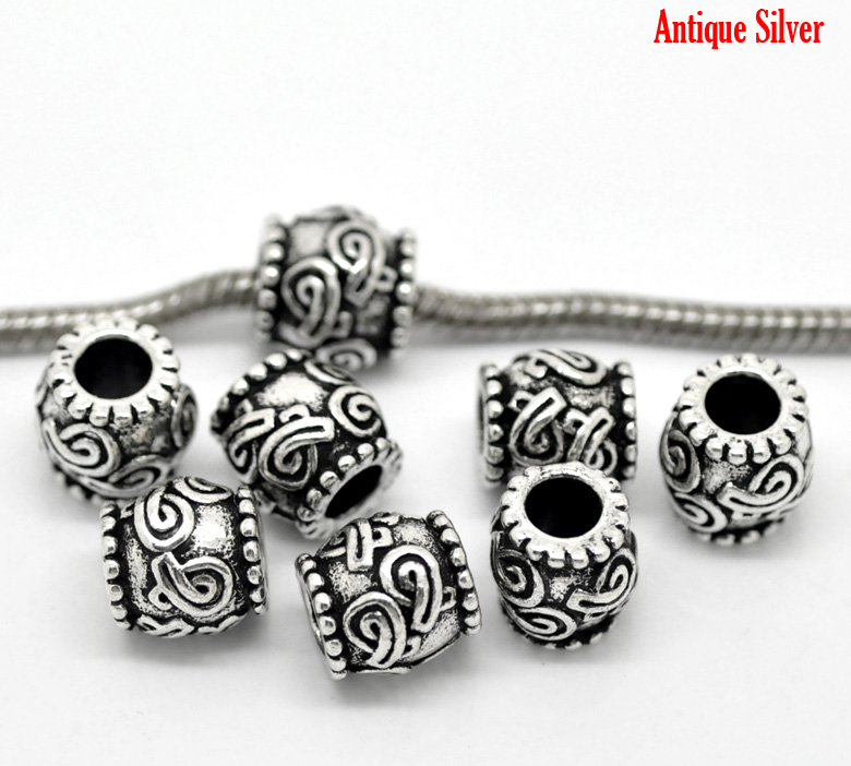 ลูกปัดเงินรูใหญ่แกะสลักริบบิ้น ขนาด 11x10mm 2 เม็ด