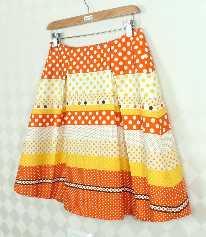 SK-265 กระโปรงแฟชั่น&ทำงาน ทรงบาน ผ้าคอตต้อนญี่ปุ่นพิมพ์ลายกราฟฟิกโทนส้ม
