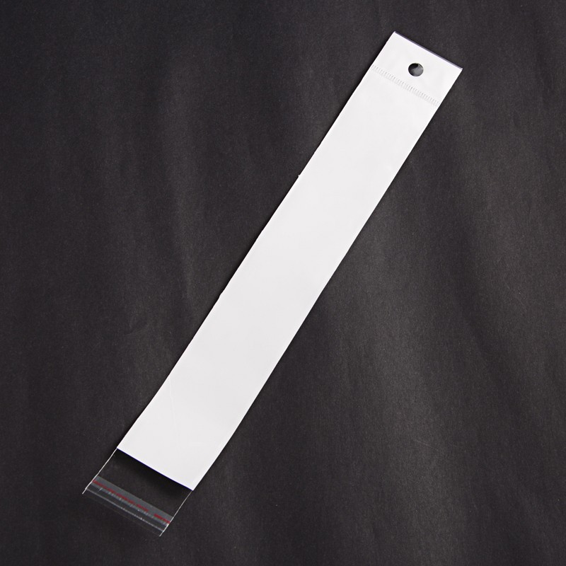 ถุงพลาสติกใส OPP(ถุงแก้ว) ฝากาว มีรูแขวนหัวมุก พลาสติก 3 ชั้น ใส่ของได้ 2 ด้าน หน้าใสกลางขาวหลังใส แคบยาว ขนาด 4x29(-5) เซนติเมตร แพ็ค 100 ใบ