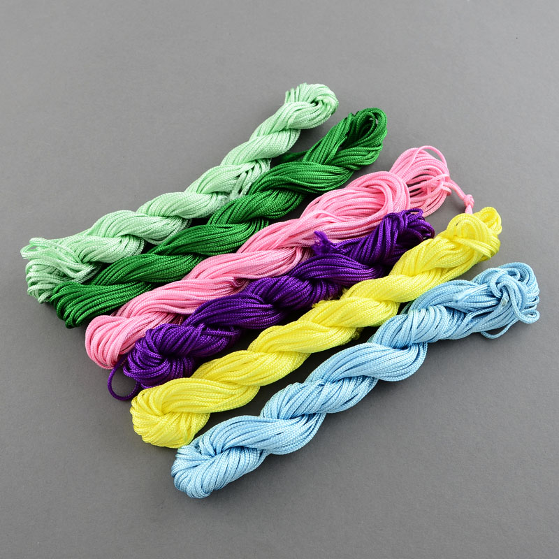 เชือกไนล่อนคละสีแบบrandom (สีอาจไม่ตรงกับในภาพ) สำหรับทำสร้อยข้อมือ ขนาด2มม. 6 ไจ