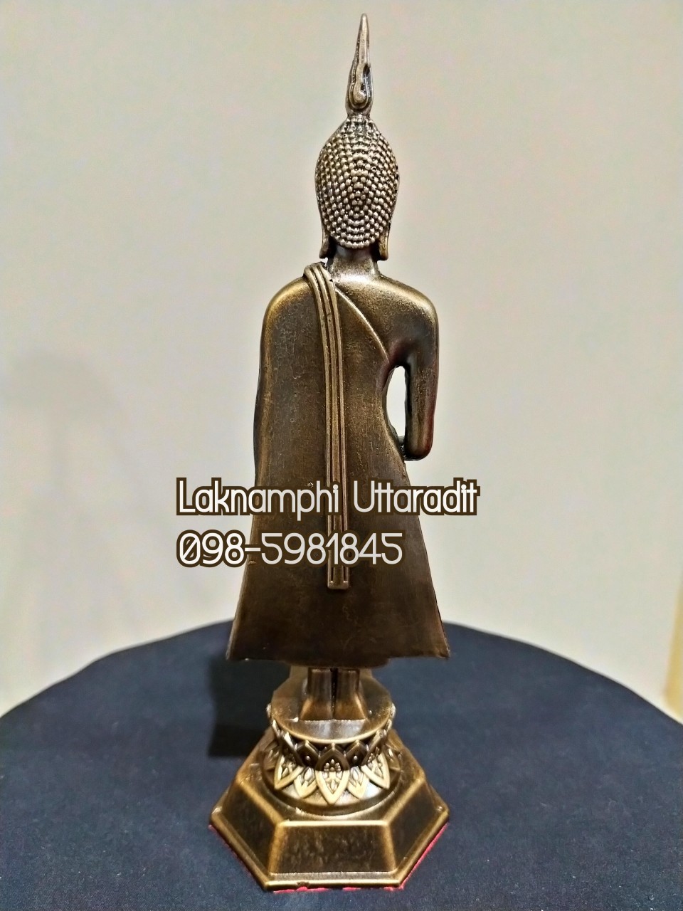 พระประจำวันพุธแร่เหล็กน้ำพี้ (กลางวัน) หรือปางอุ้มบาตร